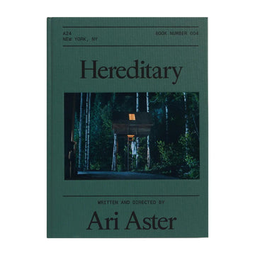 Cover of the 'Hereditary' screenplay book featuring a house in a forest setting with a dark, moody atmosphere.